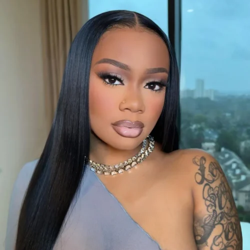 Black woman with make up. A brown lip liner and pale pink lipstick