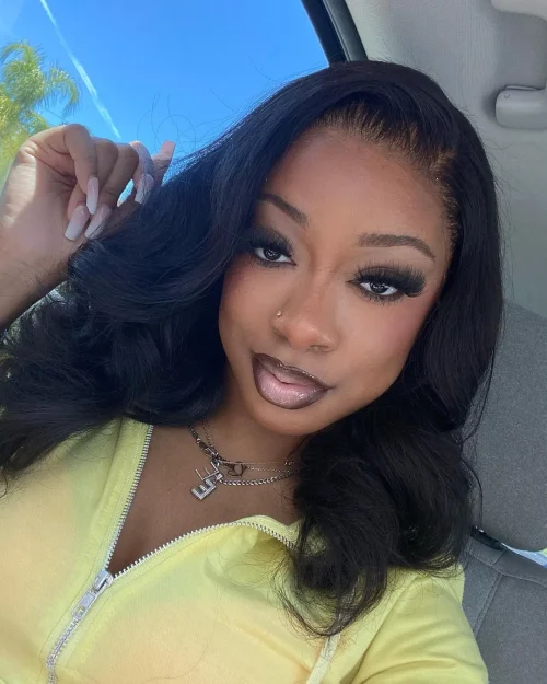 Black woman with make up. A brown lip liner and pale pink lipstick