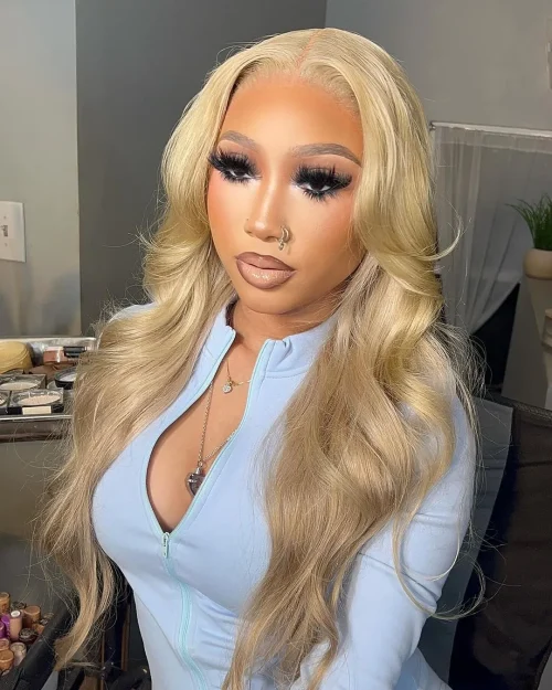 Black woman with make up. A brown lip liner and pale pink lipstick