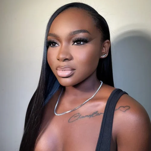 Black woman with make up. A brown lip liner and pale pink lipstick