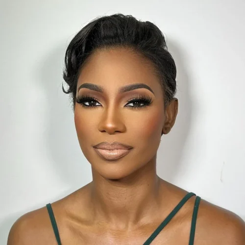 Black woman with make up. A brown lip liner and pale pink lipstick