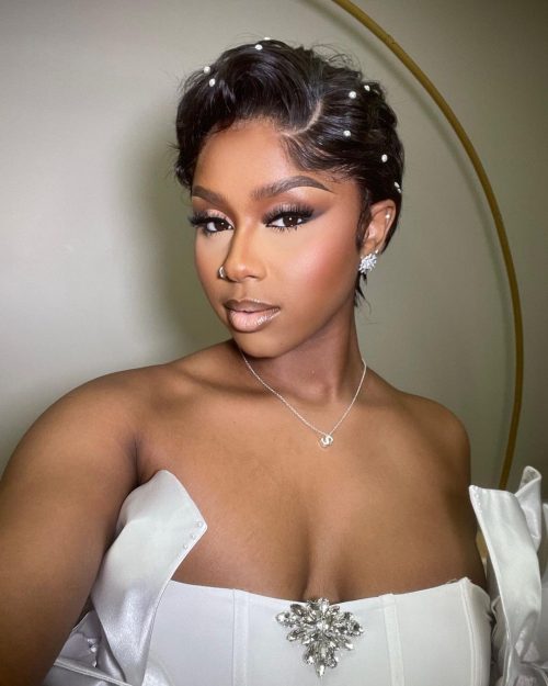 Black woman with make up. A brown lip liner and pale pink lipstick