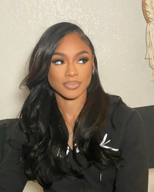 Black woman with make up. A brown lip liner and pale pink lipstick