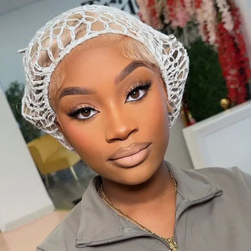 Black woman with make up. A brown lip liner and pale pink lipstick