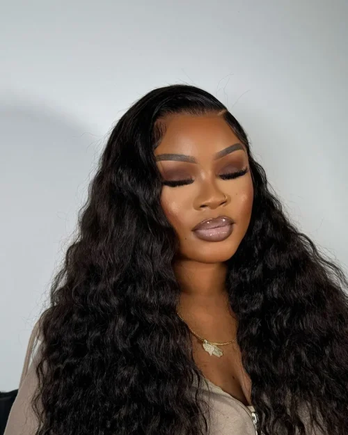 Black woman with make up. A brown lip liner and pale pink lipstick