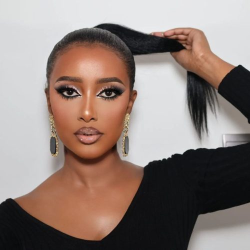 Black woman with make up. Black eyeliner to define the eyes with shimmer around